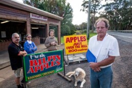 Aggrieved Bilpin business owners and their signs (Photo: Geoff Jones, Hawkesbury Gazette)
